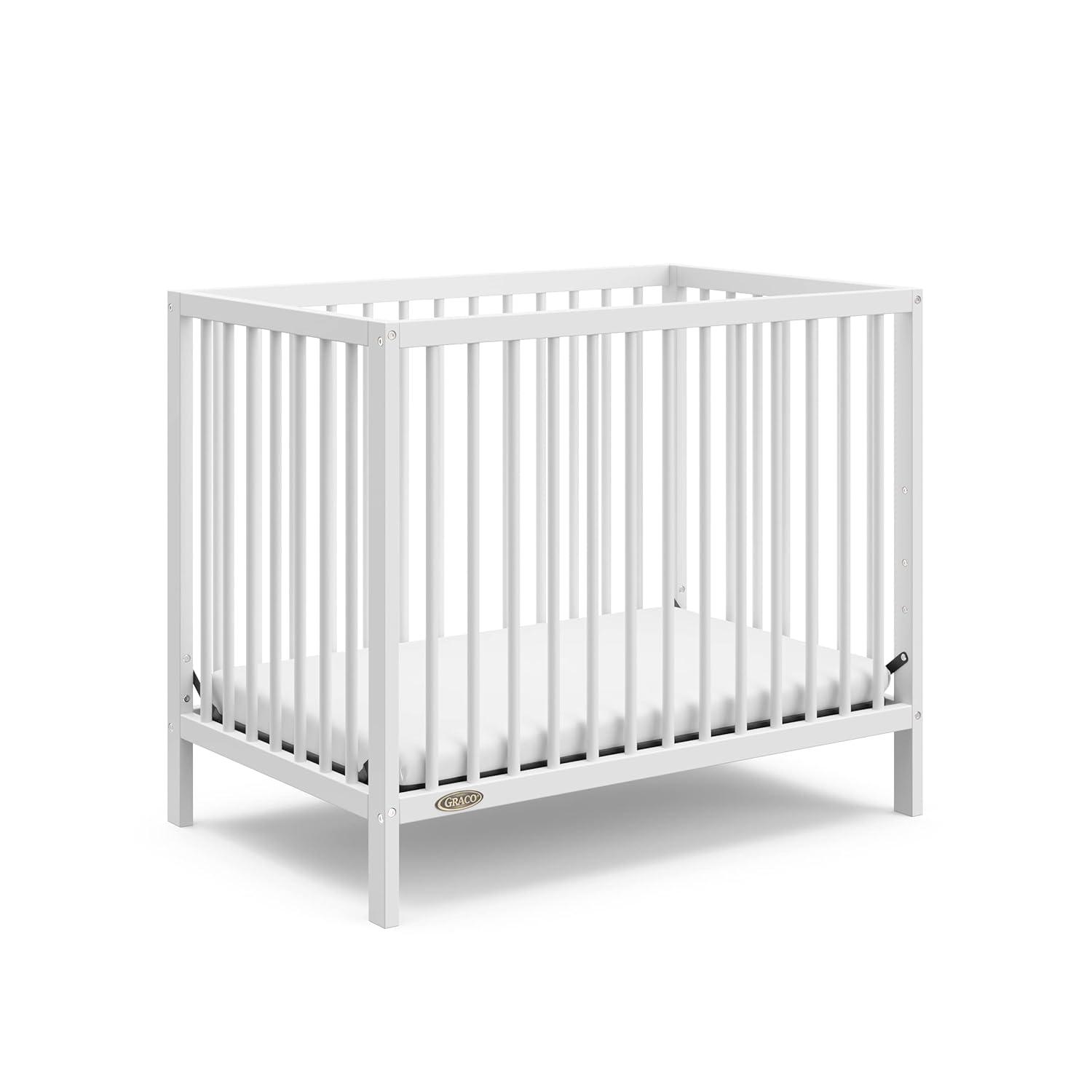 imageGraco Teddi 4in1 Convertible Mini Crib with Bonus WaterResistant Mattress Driftwood GREENGUARD Gold Certified 275Inch Mattress Included Ideal for Small Spaces Easy 30Minute AssemblyWhite