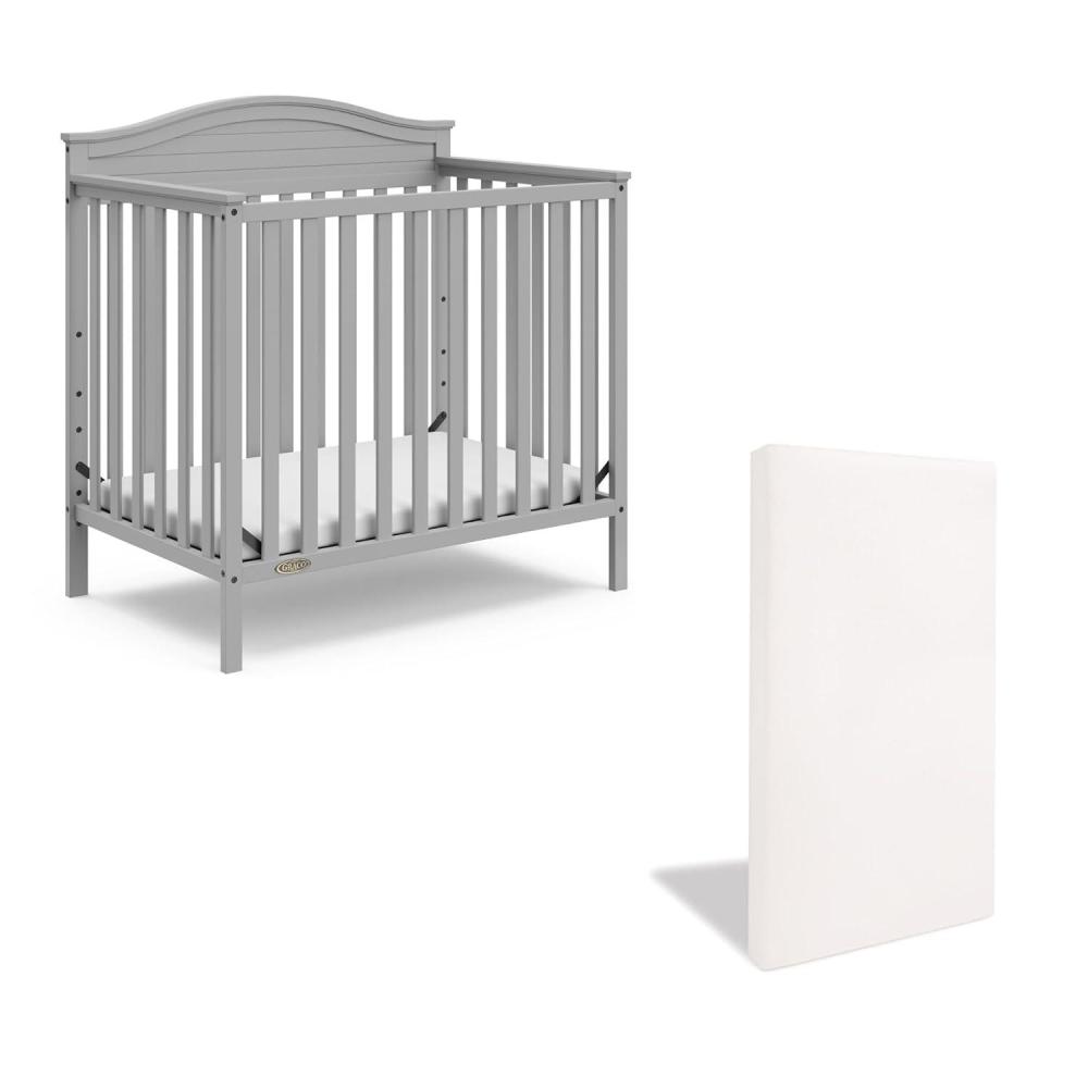 imageGraco Stella 4in1 Convertible Mini Crib with Bonus Mattress Driftwood Includes Bonus 275 Inch Thick Mattress with WaterResistant Cover Converts to Twin Bed Ideal Crib for Small SpacesPebble Gray
