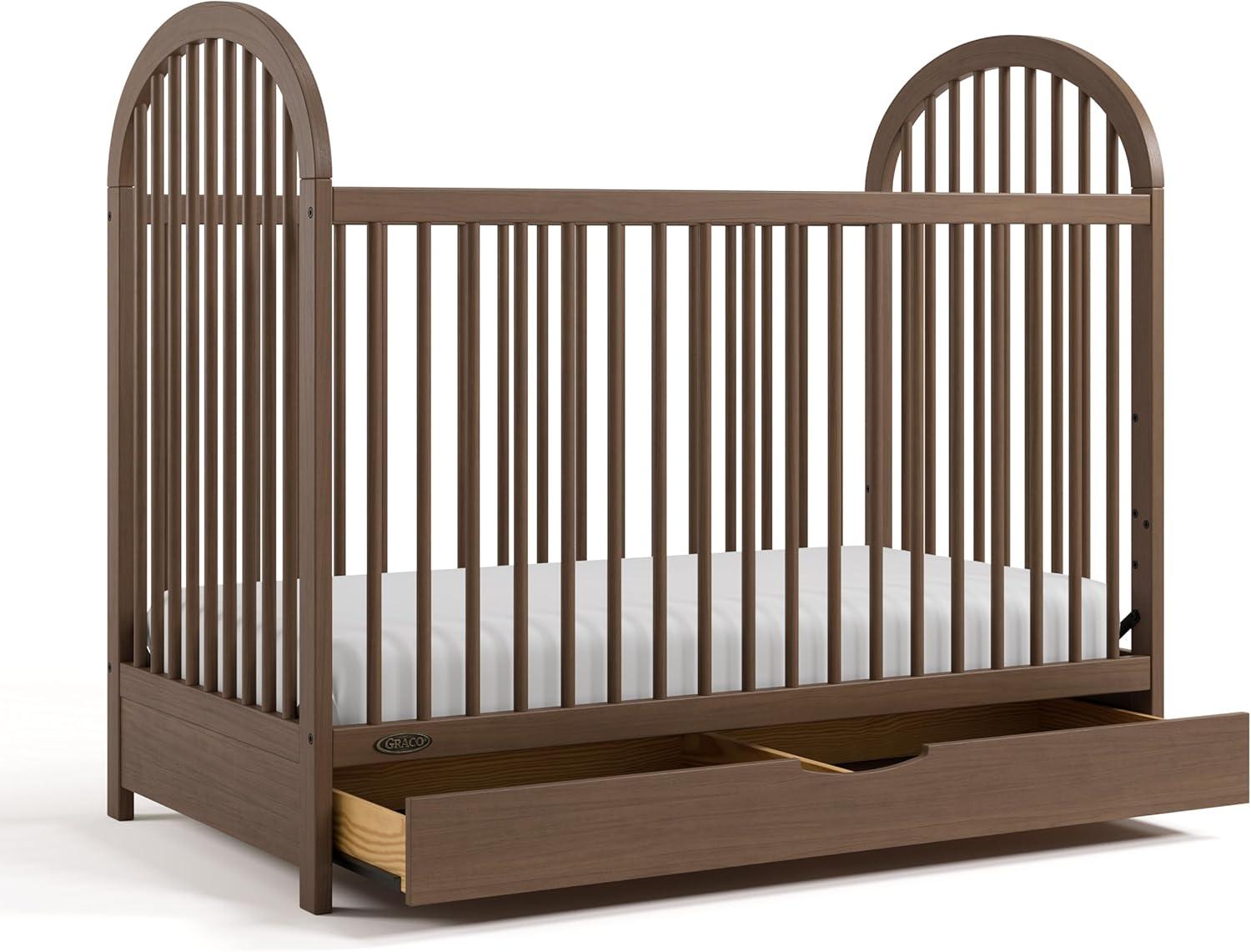imageGraco Olivia Convertible Crib Black GREENGUARD Gold Certified 100 Solid Wood Fits Standard Crib Mattress Converts to Toddler Bed and Daybed 4 Adjustable Mattress HeightsHazelnut